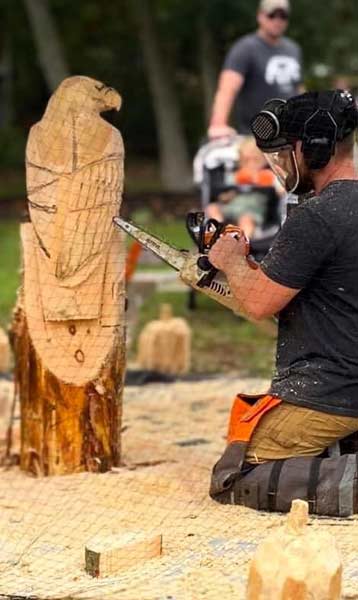 Live wood carving demonstration at Harvest Moon Acres